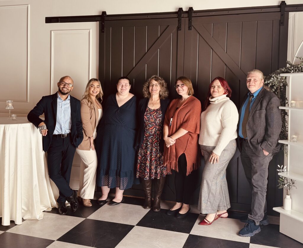 left to right: Frank Martinez Lopez, Executive Director, Enlace de Familias, Jaysleen Gonzalez, Administrative Assistant, Holyoke Community Connections; Gabrielle Glasier, Community Connections Coordinator, North Adams Community Connections; Stacey Langknecht, Family Engagement Director, Brick House Community Connections; Heather Bialecki-Canning, Executive Director, North Quabbin Community Connections; Jasarah Burgos, Springfield Community Connections; and Tom Taffe, Executive Director Brick House
